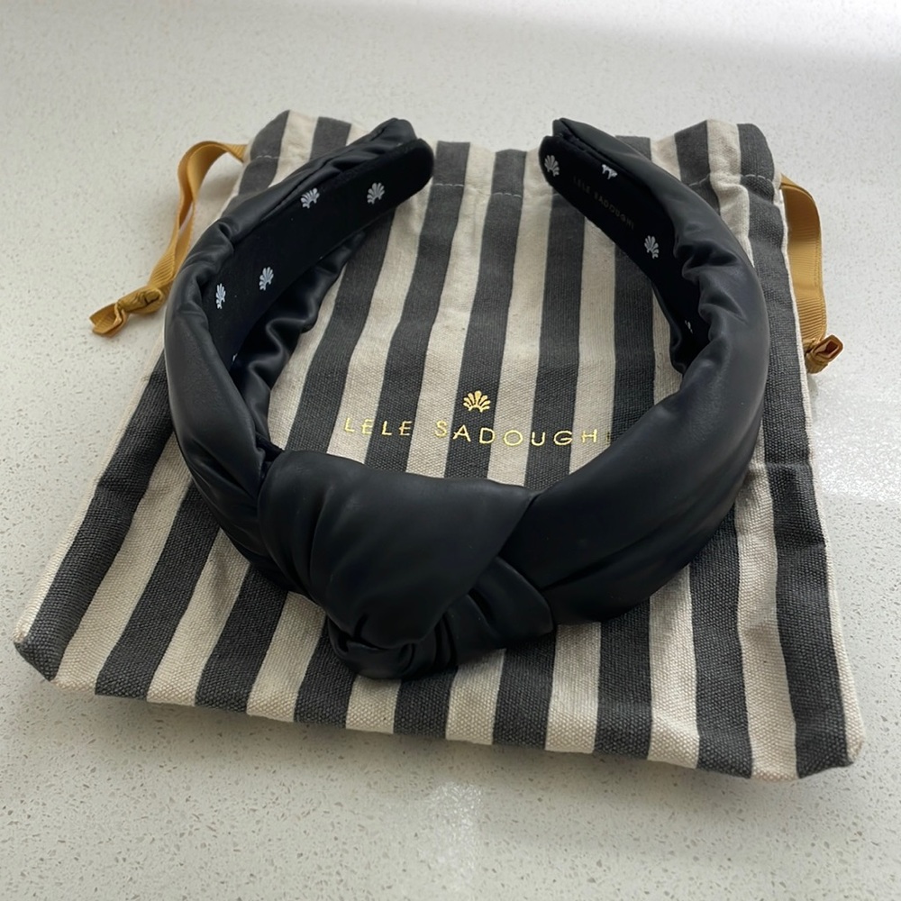 Like new Lele Sadoughi black faux leather headband. Comes with dust bag.